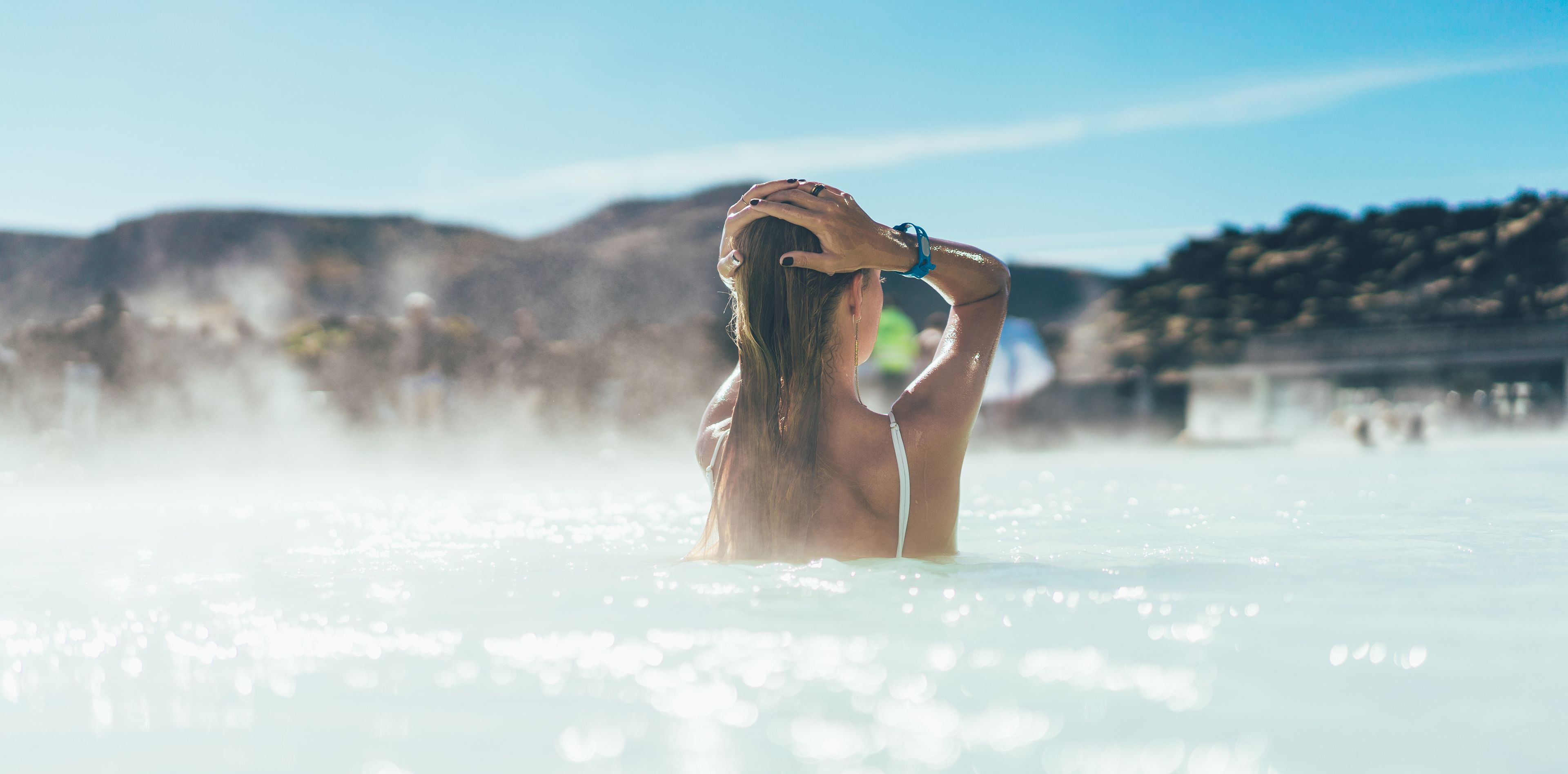 Woman relaxes in thermal bath